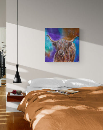 Painting of a highland cow on a wall above a bed with brown bedding.